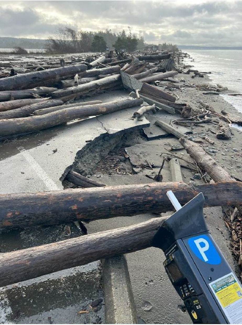 caption: Heavy winter storms damaged a parking area at Deception Pass State Park on Whidbey Island in Washington state in January.