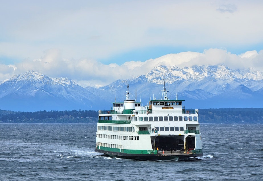 caption: The M/V Kaleetan ferry heads toward Seattle on Puget Sound with the Olympic Mountains in the background. Monday, April 11, 2022.