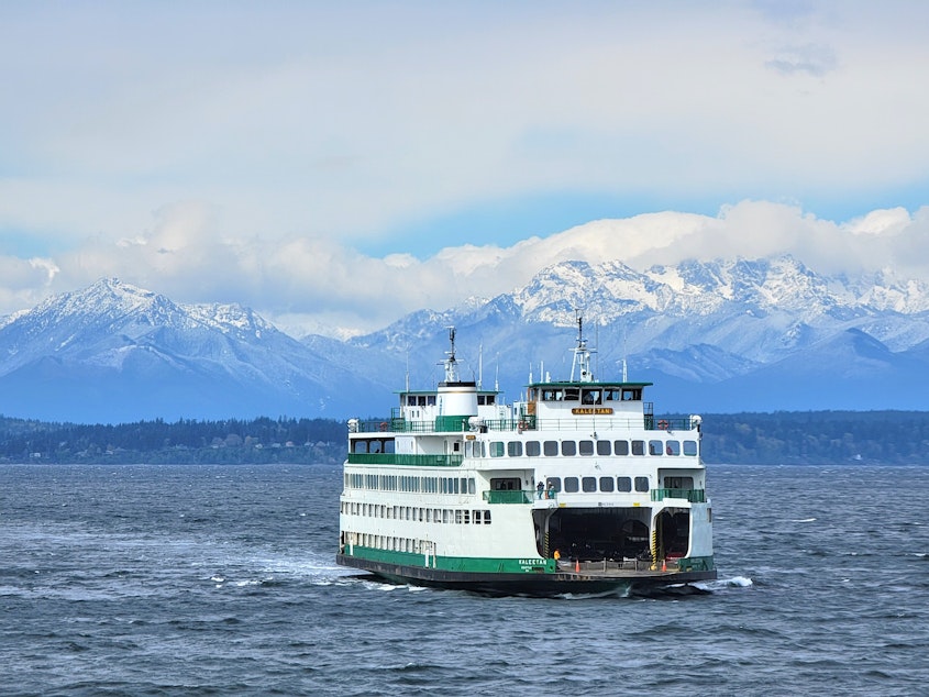caption: The M/V Kaleetan ferry heads toward Seattle on Puget Sound with the Olympic Mountains in the background. Monday, April 11, 2022.