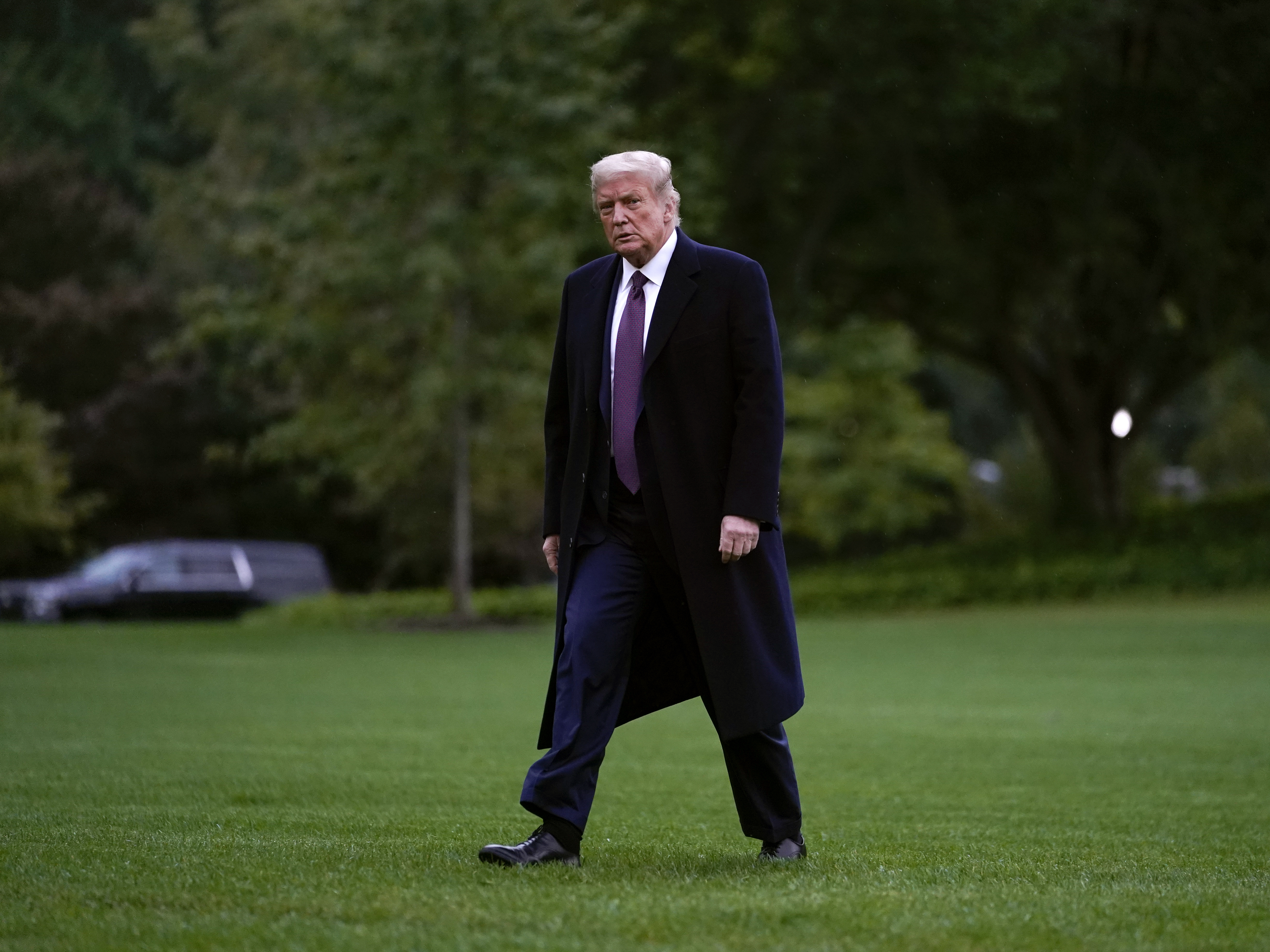 caption: President Trump walks from Marine One to the White House on Thursday, as he returns from a fundraiser in Bedminster, N.J.