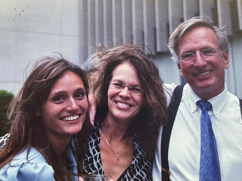 caption: This is me with my parents at my grad school graduation in the Spring of 2004.