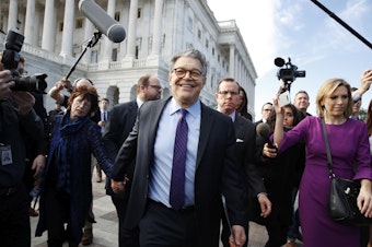 caption: Sen. Al Franken, D-Minn., center, holds hands with his wife Franni Bryson, as he leaves the Capitol after speaking on the Senate floor, Thursday, Dec. 7, 2017, on Capitol Hill in Washington. Franken resigned soon after following a wave of sexual misconduct allegations and a collapse of support from his Democratic colleagues.