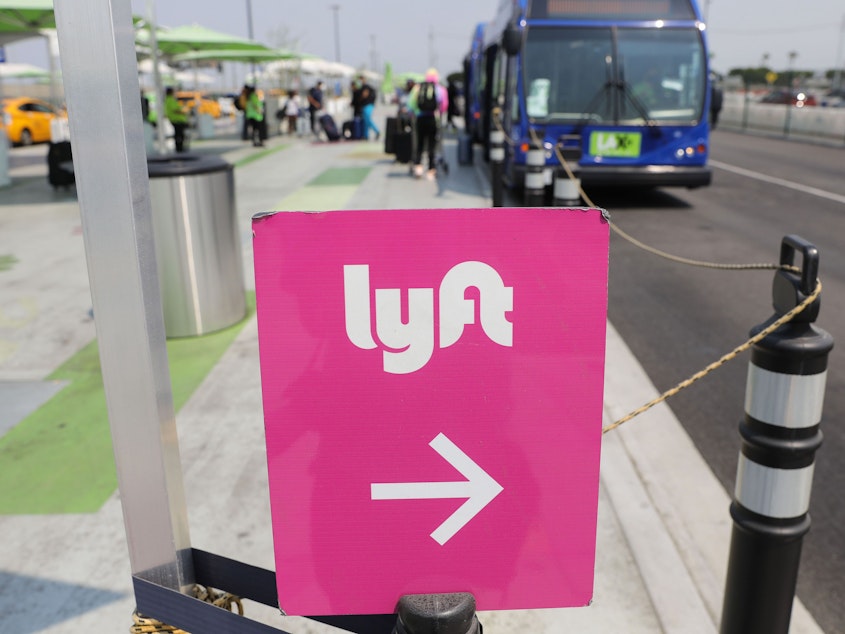 caption: Lyft said it would pay the legal fees for any of its drivers sued under Texas' new abortion law, which it called "incompatible" with company values. Uber quickly followed suit.
