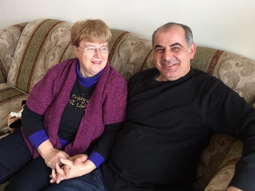 caption: Pamela and Afshin Raghebi in a family photo. The couple has been separated since Afshin left the U.S. to seek permanent legal status and has not been permitted to return home.