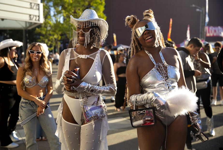 caption: Kieyira Flintroy, left, and Tyrianna Franklin of Las Vegas laugh while waiting in line to see Beyonce’s Seattle stop on the Renaissance World Tour on Thursday, Sept. 14, 2023, at Lumen Field in Seattle. 