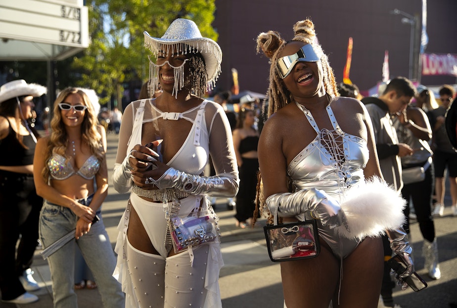 caption: Kieyira Flintroy, left, and Tyrianna Franklin of Las Vegas laugh while waiting in line to see Beyonce’s Seattle stop on the Renaissance World Tour on Thursday, Sept. 14, 2023, at Lumen Field in Seattle.