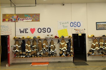 caption: Messages of support hang inside the Oso Fire Department.