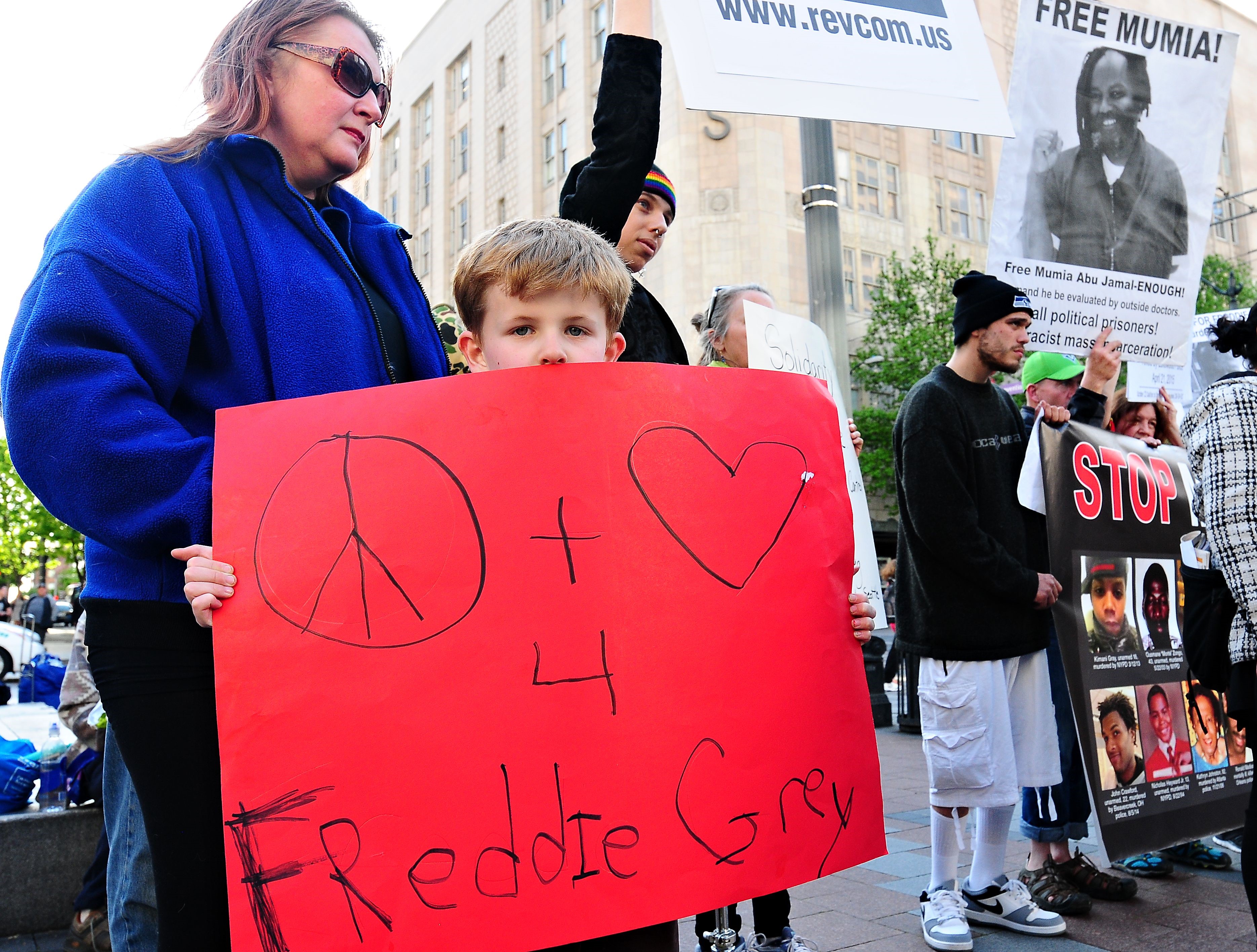 caption: Kingston Howell, 7, joined a Seattle protest in support of Freddie Gray, a black man from Baltimore who died of injuries sustained in police custody.