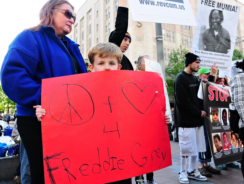 caption: Kingston Howell, 7, joined a Seattle protest in support of Freddie Gray, a black man from Baltimore who died of injuries sustained in police custody.