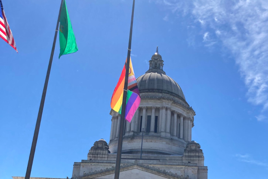 caption: A new, more inclusive Pride flag debuts at the Washington Capitol in Olympia on Tuesday, June 21, 2022. 
