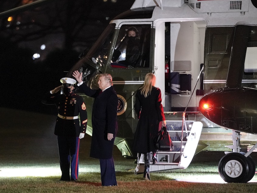 caption: President Trump prepares to board Marine One on the South Lawn of the White House on Monday.