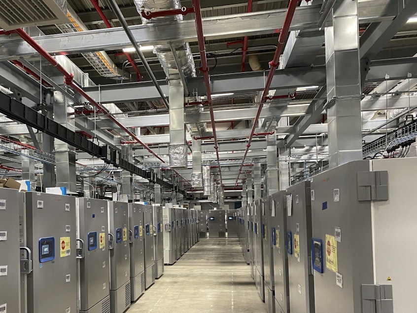 caption: Refrigerators store Pfizer's COVID-19 vaccine at a company facility in Kalamazoo, Mich.