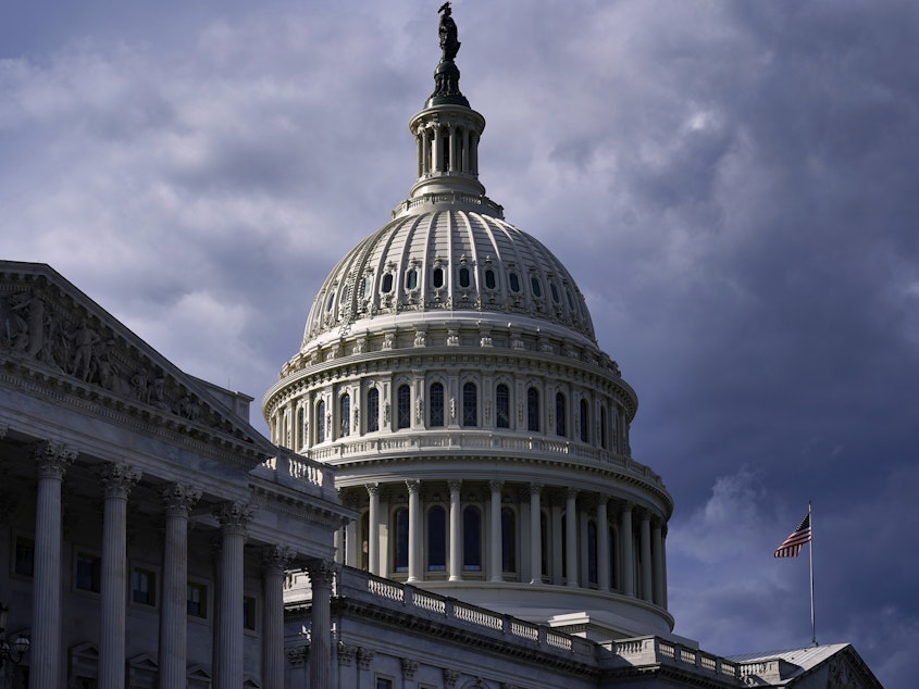caption: The U.S. Capitol in Washington, Monday, Oct. 4, 2021, as President Joe Biden urged Republican senators to "get out of the way" and let Democrats suspend the nation's debt limit, hoping to keep the U.S. government from bumping dangerously close to a credit default. (AP Photo/J. Scott Applewhite)