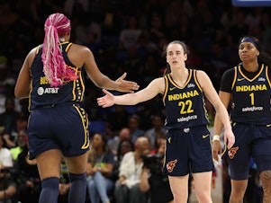 caption: Caitlin Clark, #22, and Aliyah Boston, #7, of the Indiana Fever during a preseason game earlier this month. Together, the two back-to-back No. 1 draft picks hope to lead the Fever to their first playoff appearance since 2016.