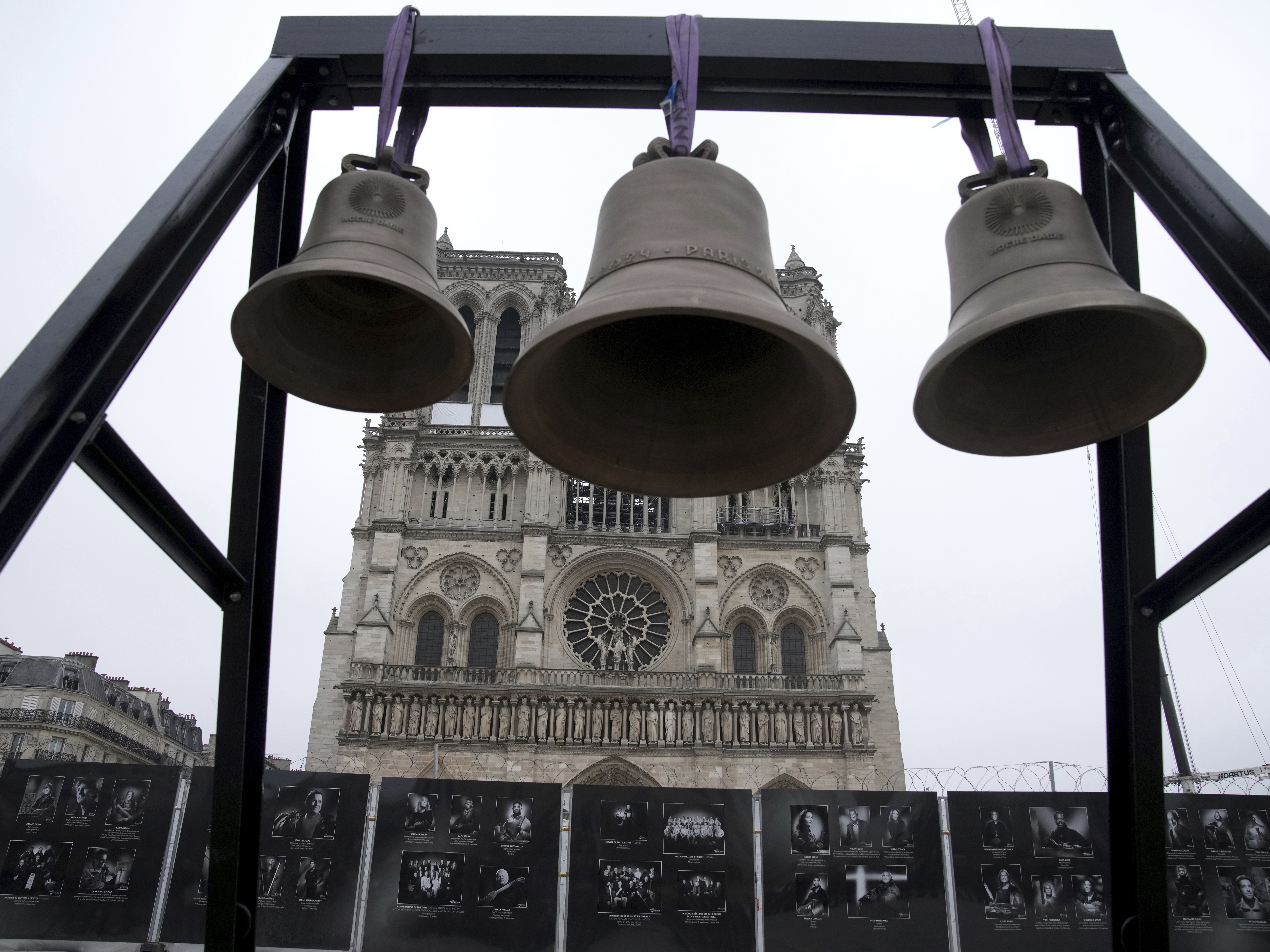 caption: A bell, center, that Olympic medalists rang at the Paris Games, is seen before being installed in Notre Dame Cathedral, ahead of the monument's grandiose reopening following a massive fire and five-year reconstruction effort, Thursday, Nov. 7, 2024 in Paris.