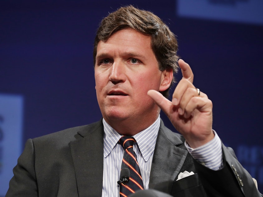 caption: A top writer for Fox News' Tucker Carlson resigned after CNN revealed his racist and sexist posts, reviving criticism of Carlson's commentaries. Carlson is set to address the controversy on Monday.