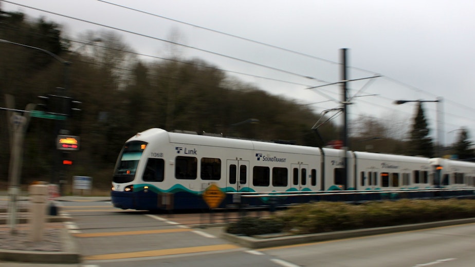 caption: A Sound Transit light rail train nears Othello station in Seattle.