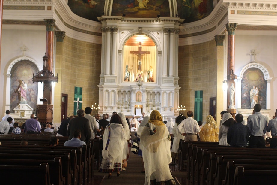 caption: A wedding ceremony at Eritrean Kidisti Selassie, an Eritrean Catholic church in Seattle. During a wedding, Eritreans from across the United States come to pray together and wish the couple good blessings.