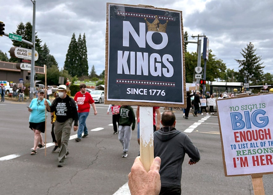 caption: People started showing up early for a planned 10 a.m. downtown Hillsboro “No Kings” protest along the city’s Southeast 10th Avenue, June 14, 2025.