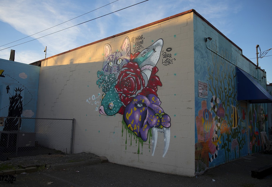 caption: Murals are on display on the back The Fish Store on Thursday, December 6, 2018, along Lake City Way Northeast in Seattle.