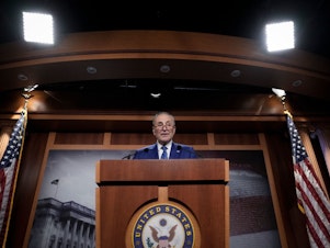 caption: Senate Majority Leader Chuck Schumer, D-N.Y., speaks during a news conference after passage of the Inflation Reduction Act at the U.S. Capitol on Sunday.