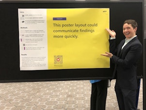 caption: Michigan State University doctoral student Mike Morrison has a redesign for scientific posters to spell out their main point in big, easy-to-read letters.