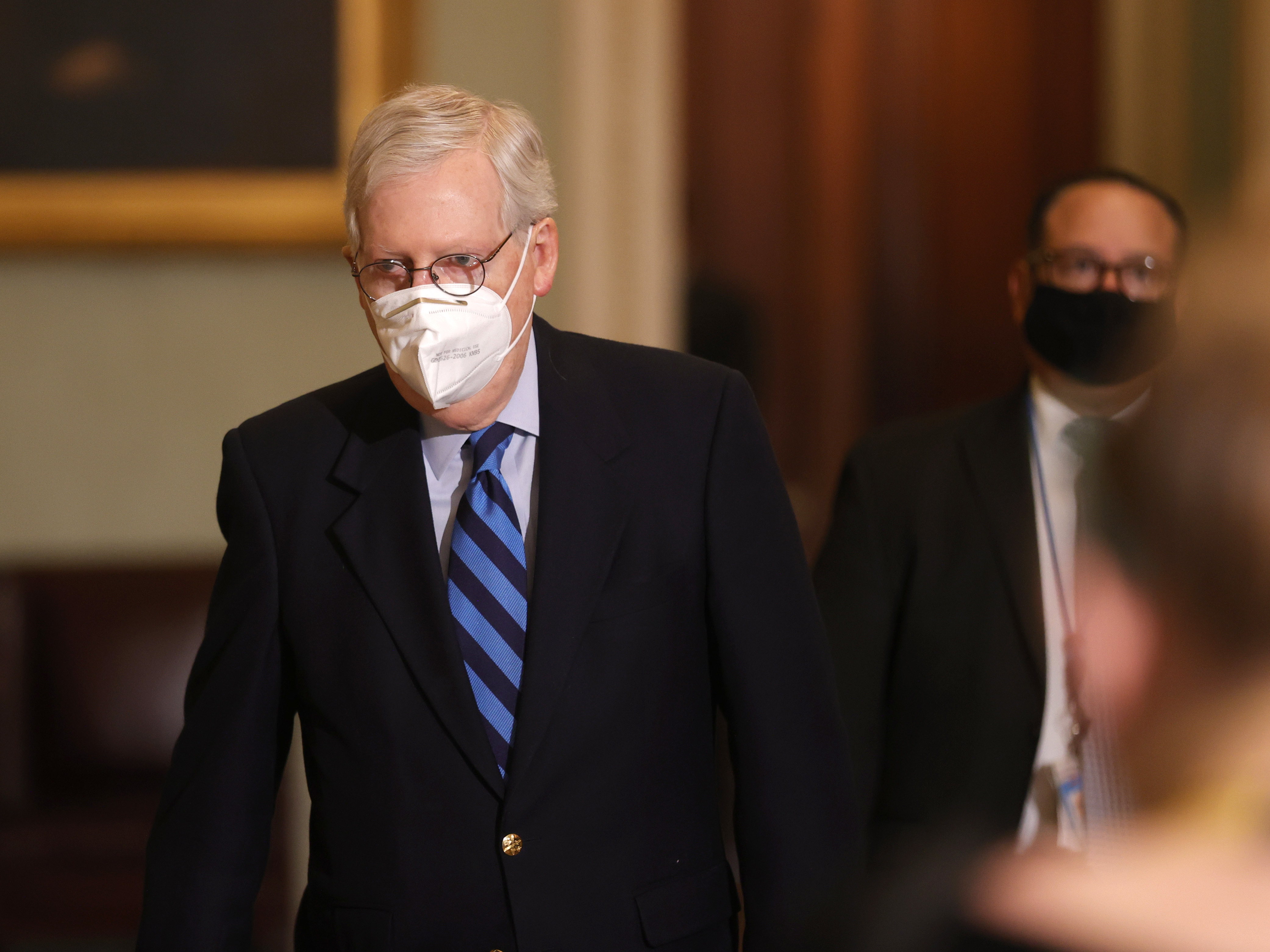caption: Senate Majority Leader Mitch McConnell leaves the Senate chamber on Tuesday. In remarks, he publicly denounced President Trump for instigating the Jan. 6 insurrection on the Capitol.