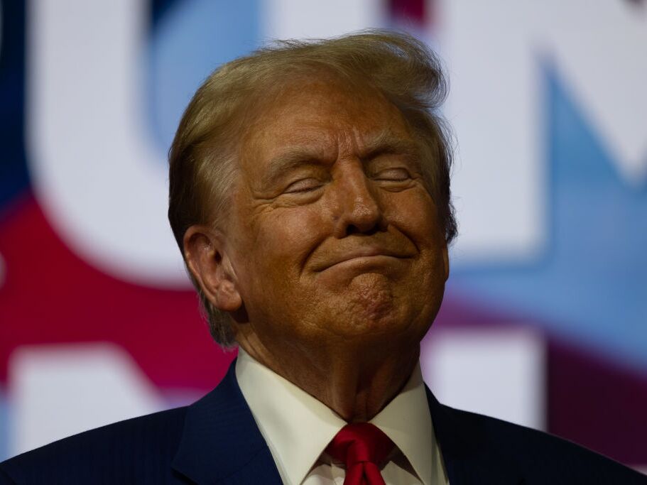 caption: Former President Donald Trump, the Republican nominee for president, holds a town hall at the Greater Philadelphia Expo Center on Monday in Oaks, Pa.