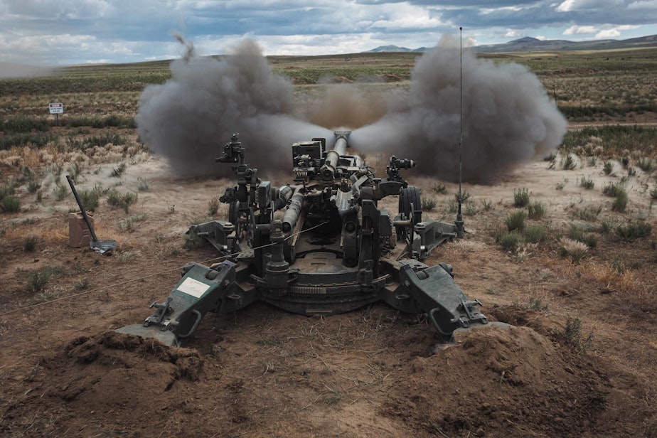 caption: U.S. Army Soldiers with the Washington National Guard, fire an M777 towed 155 mm howitzer at a direct fire range during annual training at the Yakima Training Center.
