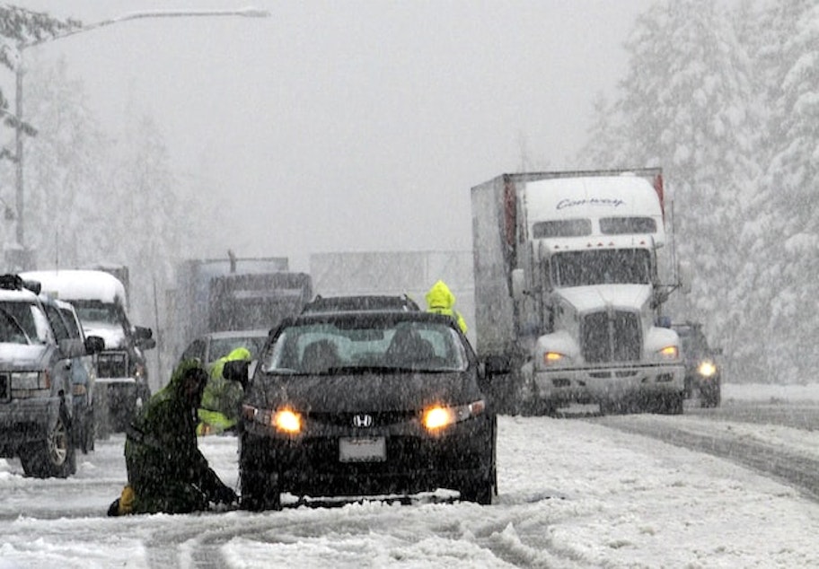 caption: Snow causing traffic disruptions in California's San Bernardino Mountains.