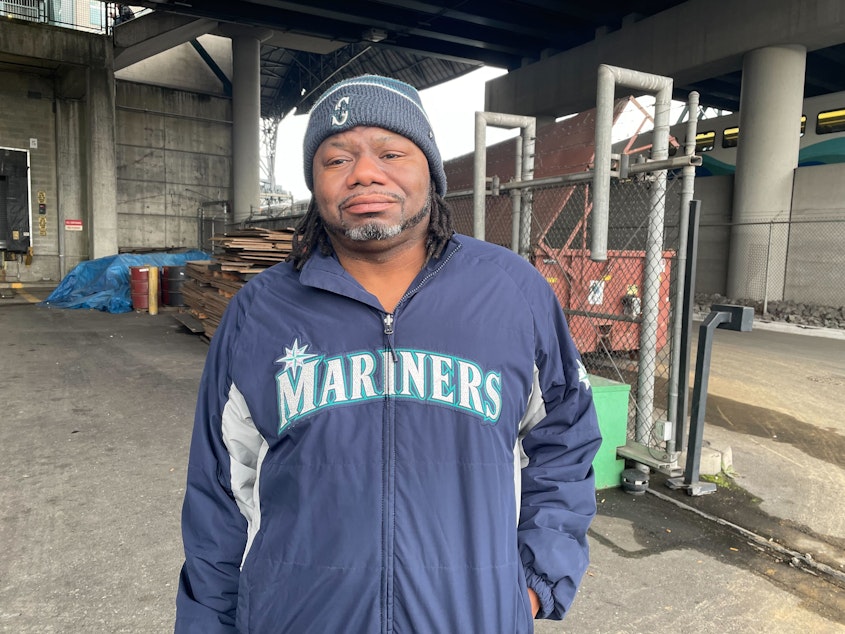 Derrick Thomas, a hot cook at T Mobile park, wears Mariners gear during a mandatory training ahead of the season