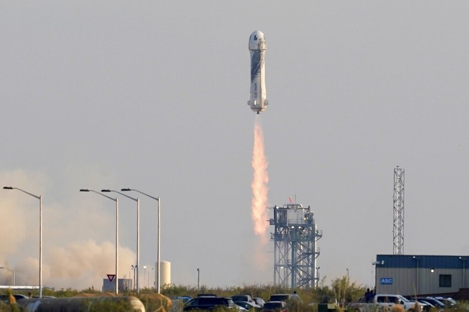 caption: Blue Origin's New Shepard rocket launches carrying passengers Jeff Bezos, founder of Amazon and space tourism company Blue Origin, brother Mark Bezos, Oliver Daemen and Wally Funk, from its spaceport near Van Horn, Texas, Tuesday, July 20, 2021.