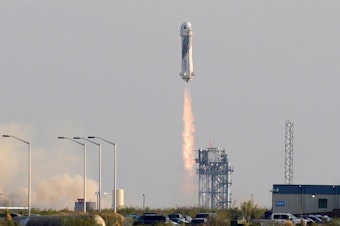 caption: Blue Origin's New Shepard rocket launches carrying passengers Jeff Bezos, founder of Amazon and space tourism company Blue Origin, brother Mark Bezos, Oliver Daemen and Wally Funk, from its spaceport near Van Horn, Texas, Tuesday, July 20, 2021. 