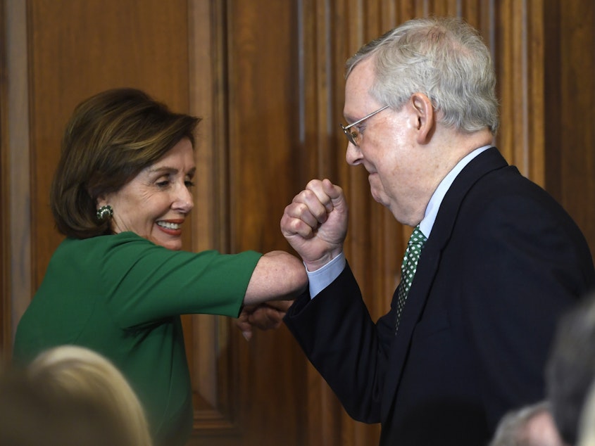 caption: House Speaker Nancy Pelosi and Senate Majority Leader Mitch McConnell bump elbows on Capitol Hill on March 12, 2020.