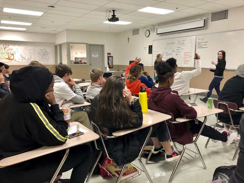 caption: Instructors lead a classroom discussion about consent and healthy relationships with a class of sophomores at Central Catholic High School in Portland, Ore., in 2019. (Gillian Flaccus/AP)