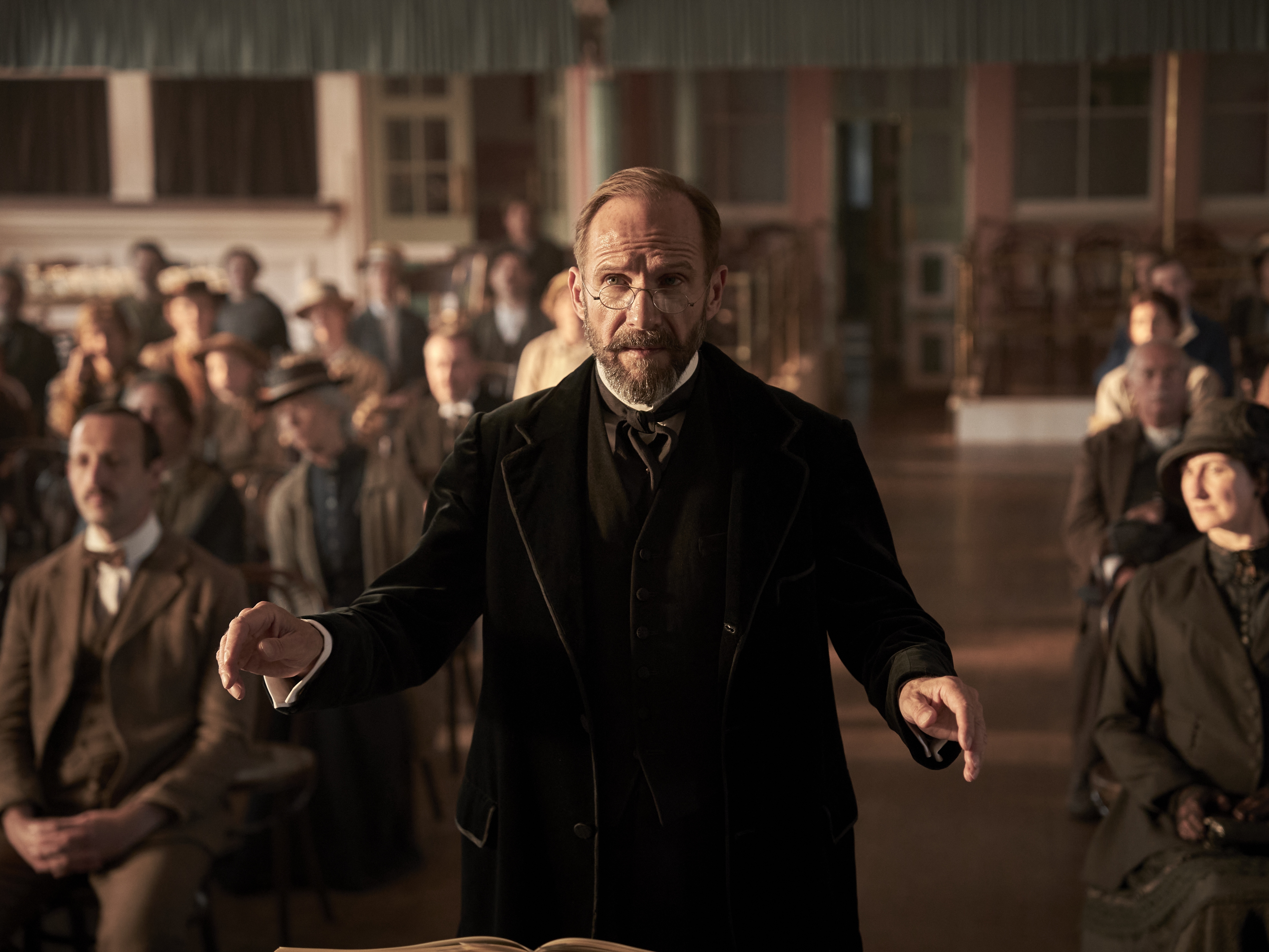 caption: Henry Guthrie, played by Ralph Fiennes, is uncompromising in his pursuit of musical excellence as he overhauls a struggling northern English choir during World War I in <em>The Choral.</em>