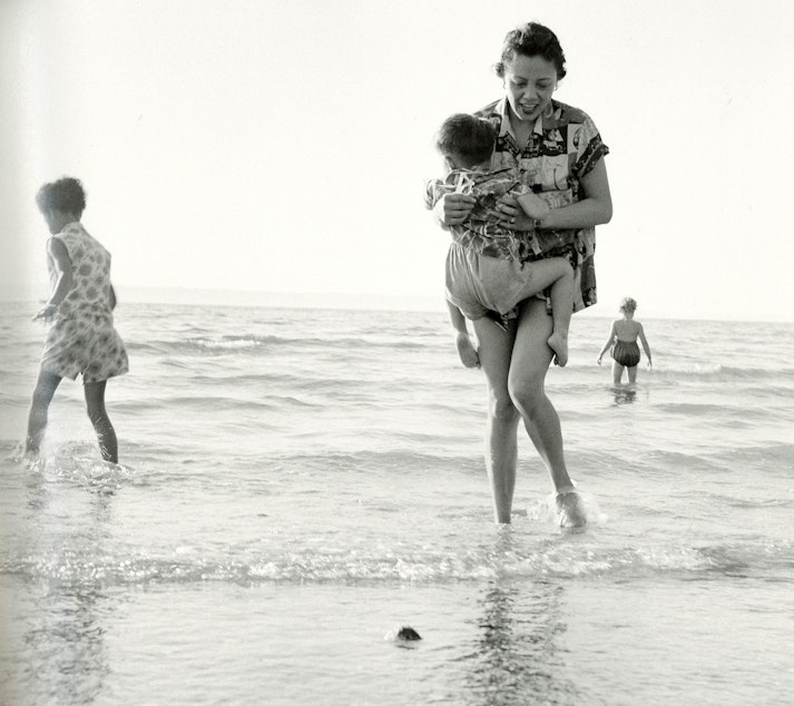 caption: Mildred Mar and her family at Saltwater State Park on Puget Sound near Des Moines, around 1960. According to the MOHAI photo book, 'Seattle on the Spot,' Mildred and her family were close with the photographer's family and enjoyed vacations together.