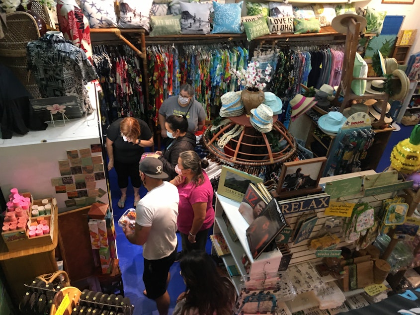 caption: Customers clamor for Hawaiian lei. The Hawai'i General Store in Seattle was at capacity on Saturday, June 12, 2021.