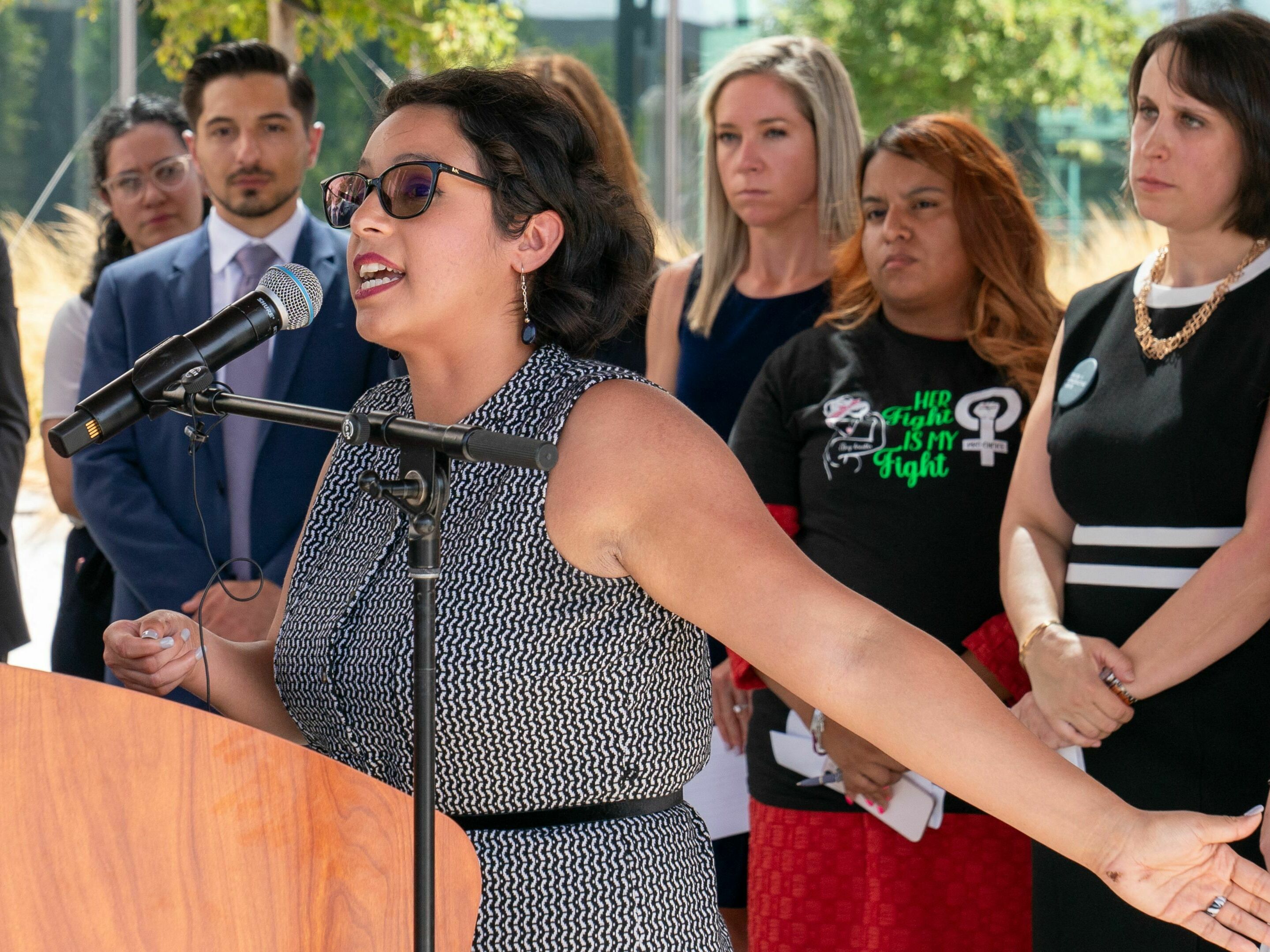 caption: Elizabeth Weller speaks at a press conference in Austin, Texas on July 19. She's one of 20 women suing the state after being denied abortions despite serious pregnancy complications.