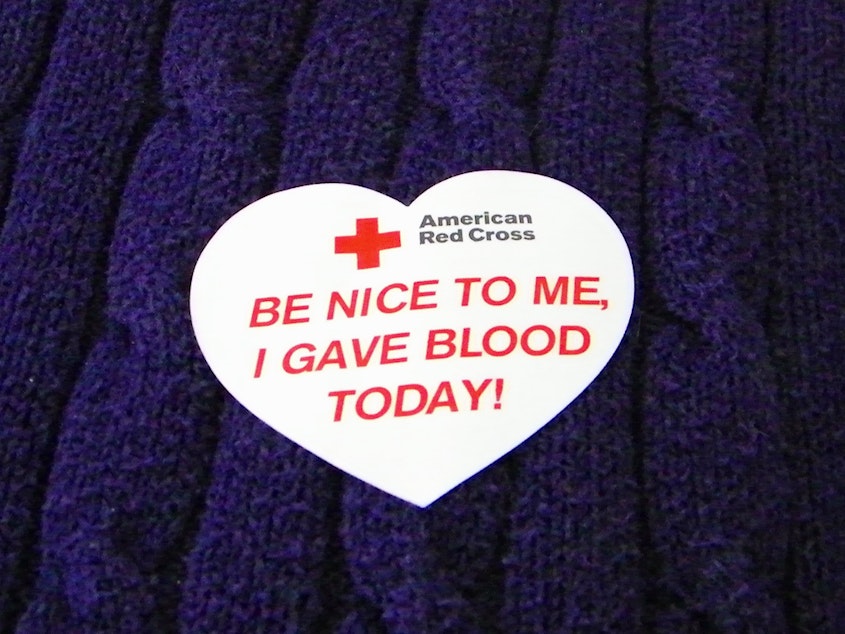 caption: Blood drive sticker from the Red Cross.