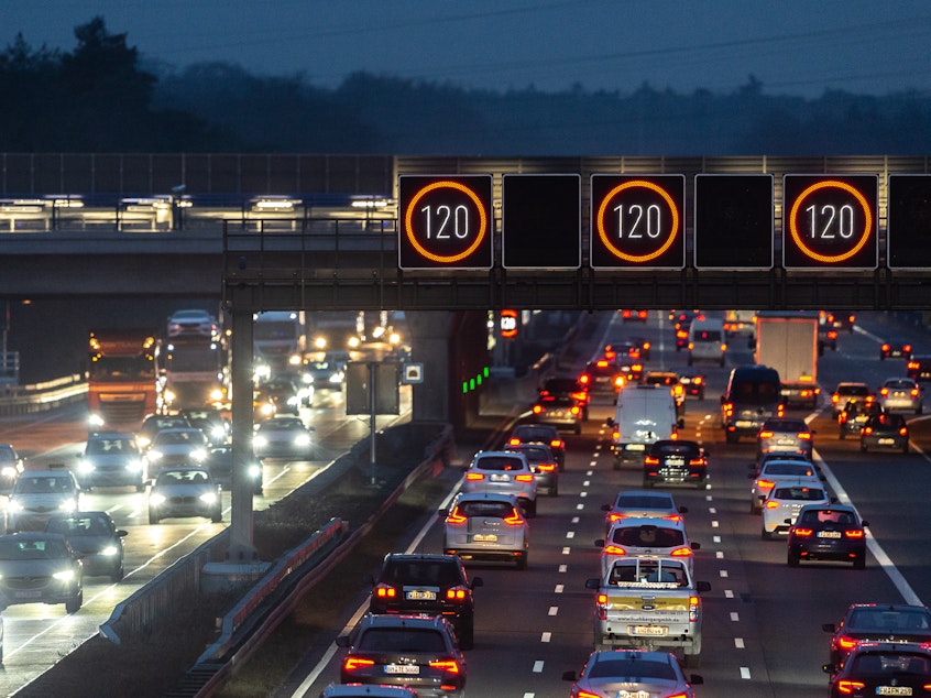 caption: Cars drive near Frankfurt Airport on Tuesday in Germany. Most German highways have no speed limit, and a proposal to cap speeds at about 80 mph has sparked controversy.