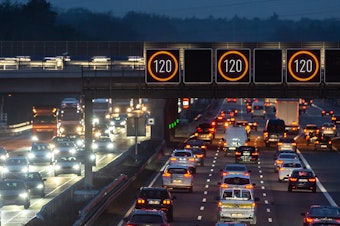 caption: Cars drive near Frankfurt Airport on Tuesday in Germany. Most German highways have no speed limit, and a proposal to cap speeds at about 80 mph has sparked controversy.