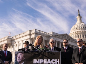 caption: Rep. Marjorie Taylor Green, R-Ga., speaks during a news conference about impeaching Department of Homeland Security Secretary Alejandro Mayorkas last winter.