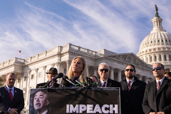 caption: Rep. Marjorie Taylor Green, R-Ga., speaks during a news conference about impeaching Department of Homeland Security Secretary Alejandro Mayorkas last winter.