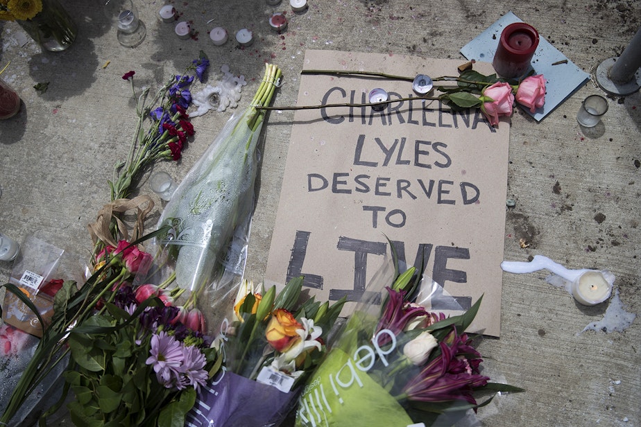 caption: FILE: A memorial for Charleena Lyles is shown outside of Solid Ground Brettler Family Place on Monday, June 19, 2017.