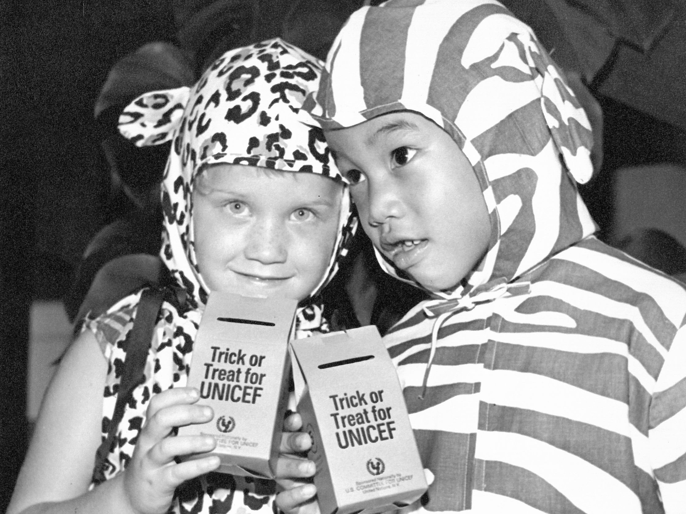 caption: This is the 75th year that costumed kids are asking not only for candy but trick or treating for UNICEF to help children in need.  The program has raised over $200 million since it began.