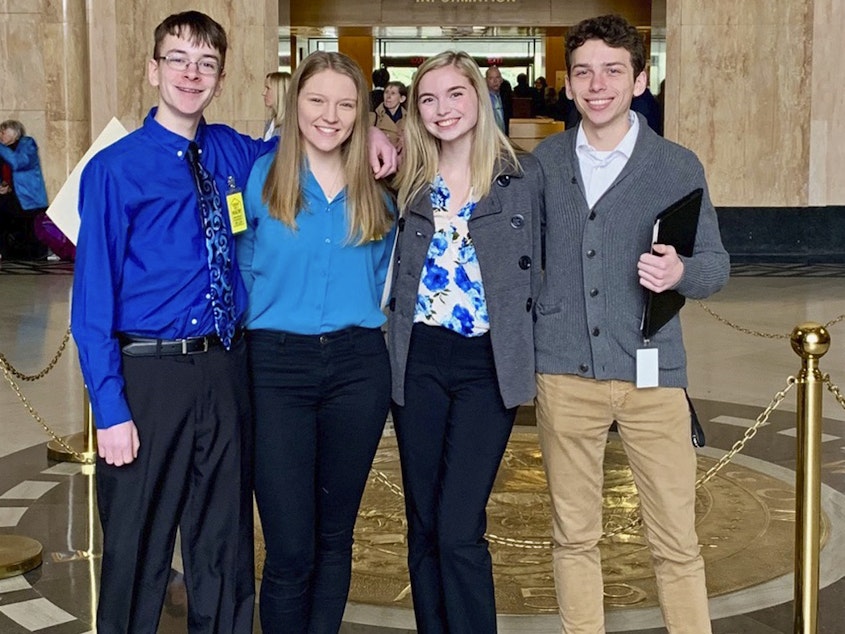 caption: (From left) Sam Adamson, Lori Riddle, Hailey Hardcastle, and Derek Evans pose at the Oregon State Capitol in Salem. The teens suggested legislation to allow students to take "mental health days" as they would sick days.