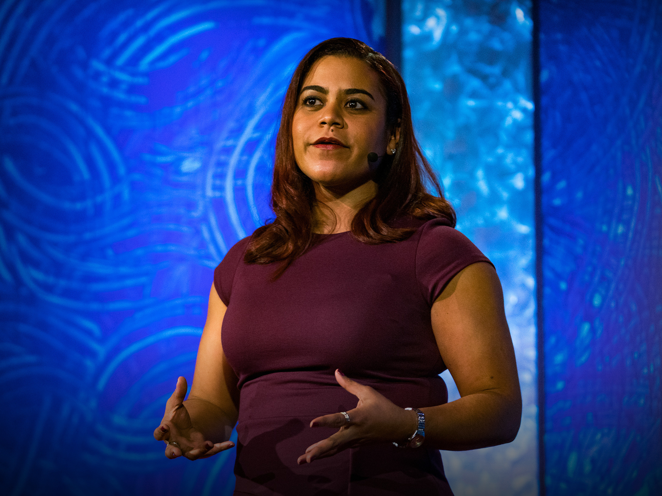 caption: Olympia Della Flora on the TED stage.