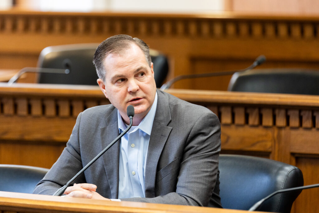 caption: John Braun speaks at a legislative session preview event Jan. 9, 2025, at the Washington State Capitol.