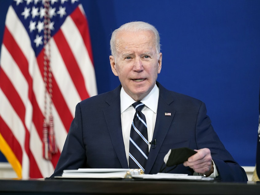 caption: President Biden speaks about the government's COVID-19 response in the Eisenhower Executive Office Building on Thursday.